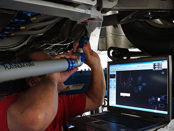 Man measuring suspension with CMM